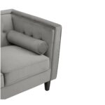 ELI Sofa with grey velvet upholstery, button-tufted backrest, bolster pillows, and black slanted oak legs, designed as a three-seat sofa.