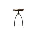 FORGE Barstool with a black metal frame and round brown and white cowhide upholstered seat, combining rustic and industrial style.