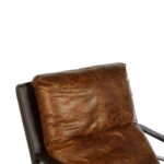 BASTIEN Tan Lounge Chair with light brown distressed leather, cushioned backrest, tonal stitching, and sleek metallic frame for a modern industrial look.