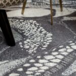 CELLS Rug, 390x280 cm, crafted from cotton chenille and wool, featuring a bold abstract cellular design in monochromatic tones for modern interiors.