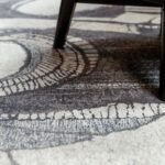 CELLS Rug, 390x280 cm, crafted from cotton chenille and wool, featuring a bold abstract cellular design in monochromatic tones for modern interiors.