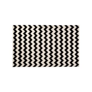 CAIN Rug with bold black and white chevron pattern, perfect for living rooms or hallways.