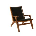 JOEY Chair with sculpted teak wood frame, plain black leather upholstery, stud detail, and mid-century modern architectural design.