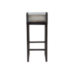 PIERCE Barstool with grey leather seat, stud detailing, and black teak wood frame with integrated footrest.