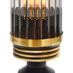 Table lamp with a solid brass and glass design, featuring a black and brushed brass finish, integrated dimmer switch, and E27 socket for versatile lighting.