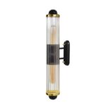 Vertical wall light with a solid brass and glass construction, black and brushed brass finish, featuring two E27 sockets for ambient illumination.