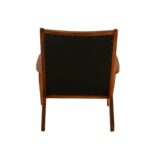 JOEY Chair with sculpted teak wood frame, plain black leather upholstery, stud detail, and mid-century modern architectural design.