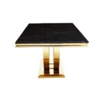 VIENA Dining Table with brushed gold arc pedestal base and black cultured marble top, featuring clean edges and a refined design.