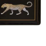 Stoneware tray with a leopard graphic, black surface, and metallic trim, perfect for decor or serving.