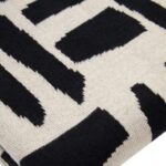 Black and natural geometric patterned throw with a textured finish, perfect for draping over a sofa, bed, or armchair.