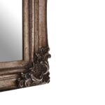 Classic wall mirror with carved motifs, weathered-effect frame, and vintage-inspired design, ideal for traditional or eclectic interiors.