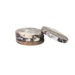 Set of four round black marble coasters with white veining, perfect for protecting surfaces in modern interiors.