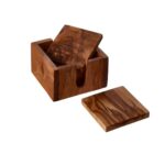 Set of four olive wood square coasters with rich grain patterns, stored in a matching acacia wood holder.