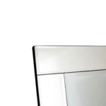 Contemporary floor mirror with off-centre alignment, bevelled edges, and a black velvet frame for a luxurious touch.