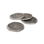 Set of four silver aluminum coin-shaped coasters with oak-textured surfaces and a polished finish.