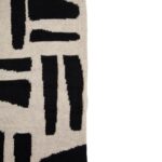 Black and natural geometric patterned throw with a textured finish, perfect for draping over a sofa, bed, or armchair.