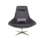 Grey velvet armchair with a silver star base, backrest cushion, and neck support, combining comfort and modern elegance.
