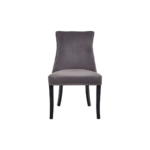 Grey velvet dining chair with button-tufted backrest, stud detailing, and solid black wood legs.