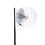 Compact silver table lamp with a clear glass globe and a black marble base, perfect for modern and minimalist interiors.