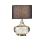 Table lamp with a metallic silver glass base, round metal plate, and black linen shade, perfect for modern interiors.