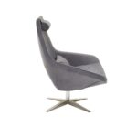 Grey velvet armchair with a silver star base, backrest cushion, and neck support, combining comfort and modern elegance.