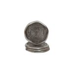 Set of four silver aluminum coin-shaped coasters with oak-textured surfaces and a polished finish.