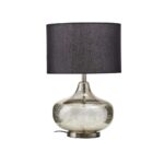 Table lamp with a metallic silver glass base, round metal plate, and black linen shade, perfect for modern interiors.