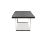Modern dining table with a black elm wood rectangular top and U-shaped stainless steel legs for an industrial design.