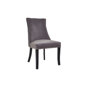 Grey velvet dining chair with button-tufted backrest, stud detailing, and solid black wood legs.