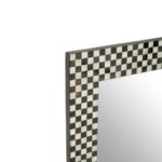 Round wall mirror with a bold black and white mother-of-pearl frame, perfect for adding a modern touch to home decor.