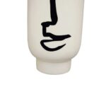 Large white ceramic vase with a cylindrical body and an abstract black face sketch for modern decor.