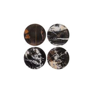 Set of four round black marble coasters with white veining, perfect for protecting surfaces in modern interiors.