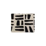 A stylish natural and black throw with a geometric tribal pattern, crafted from soft polyester for a cosy and modern home décor touch.