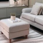 MARIE Rug – Elegant wave-patterned indoor/outdoor rug in soft greys, browns, and taupe, crafted from durable polyester.