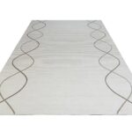 LYNNE Rug – Modern abstract brown circular weave rug with a plush 12mm pile height, crafted from durable polyester.