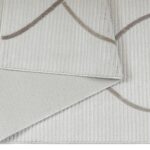 LYNNE Rug – Modern abstract brown circular weave rug with a plush 12mm pile height, crafted from durable polyester.