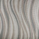 MARIE Rug – Elegant wave-patterned indoor/outdoor rug in soft greys, browns, and taupe, crafted from durable polyester.
