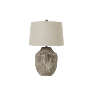 Ochre Carved Table Lamp with linen shade, featuring an artisanal ceramic base, perfect for rustic, boho, and farmhouse interiors.