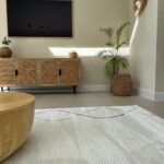 LYNNE Rug – Modern abstract brown circular weave rug with a plush 12mm pile height, crafted from durable polyester.