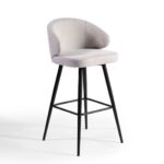 Sand-coloured upholstered barstool with curved backrest and black metal legs for stylish and comfortable high seating.