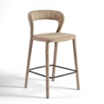 Modern taupe upholstered barstool with curved backrest and black metal footrest, ideal for kitchen islands and bar counters.