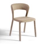 Taupe upholstered dining chair with curved backrest and minimalist design, perfect for modern or transitional dining spaces.