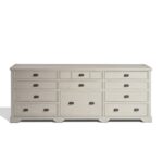 Large wooden sideboard with 11 drawers in a white oak finish and dark metal handles, ideal for living or dining rooms.