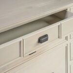 Large wooden sideboard with 11 drawers in a white oak finish and dark metal handles, ideal for living or dining rooms.