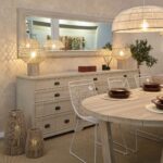 Large wooden sideboard with 11 drawers in a white oak finish and dark metal handles, ideal for living or dining rooms.