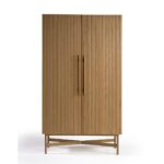 Tall oak cabinet with slatted wooden doors, gold metal base and handles, modern storage solution in natural finish.