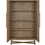 Tall oak cabinet with slatted wooden doors, gold metal base and handles, modern storage solution in natural finish.