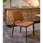 Natural oak wood sideboard with four sculpted relief doors and aged gold metal legs, offering elegant storage for living or dining spaces.