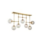 Elegant chandelier with antique gold frame and seven glass globes, perfect for modern dining rooms or statement ceilings.