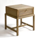 Natural oak bedside table with one drawer and slim oak legs, minimalist design perfect for modern or Scandinavian bedrooms.